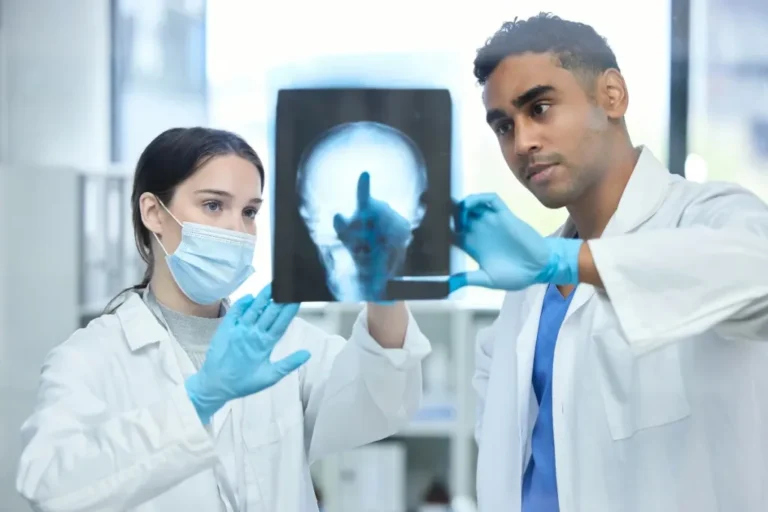 Two doctors looking at a piece of paper