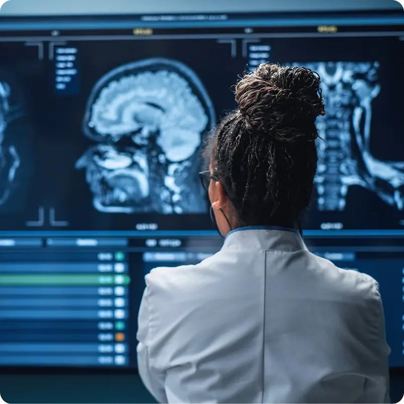 Neurologist in front of scan