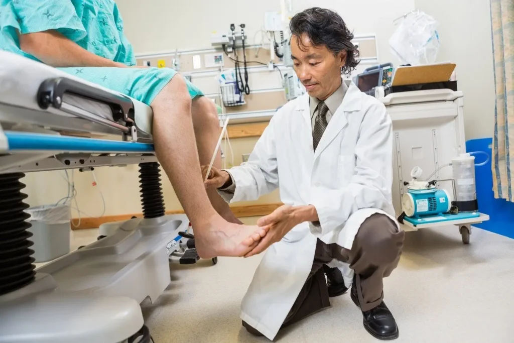 Doctor doing a test on a patients foot