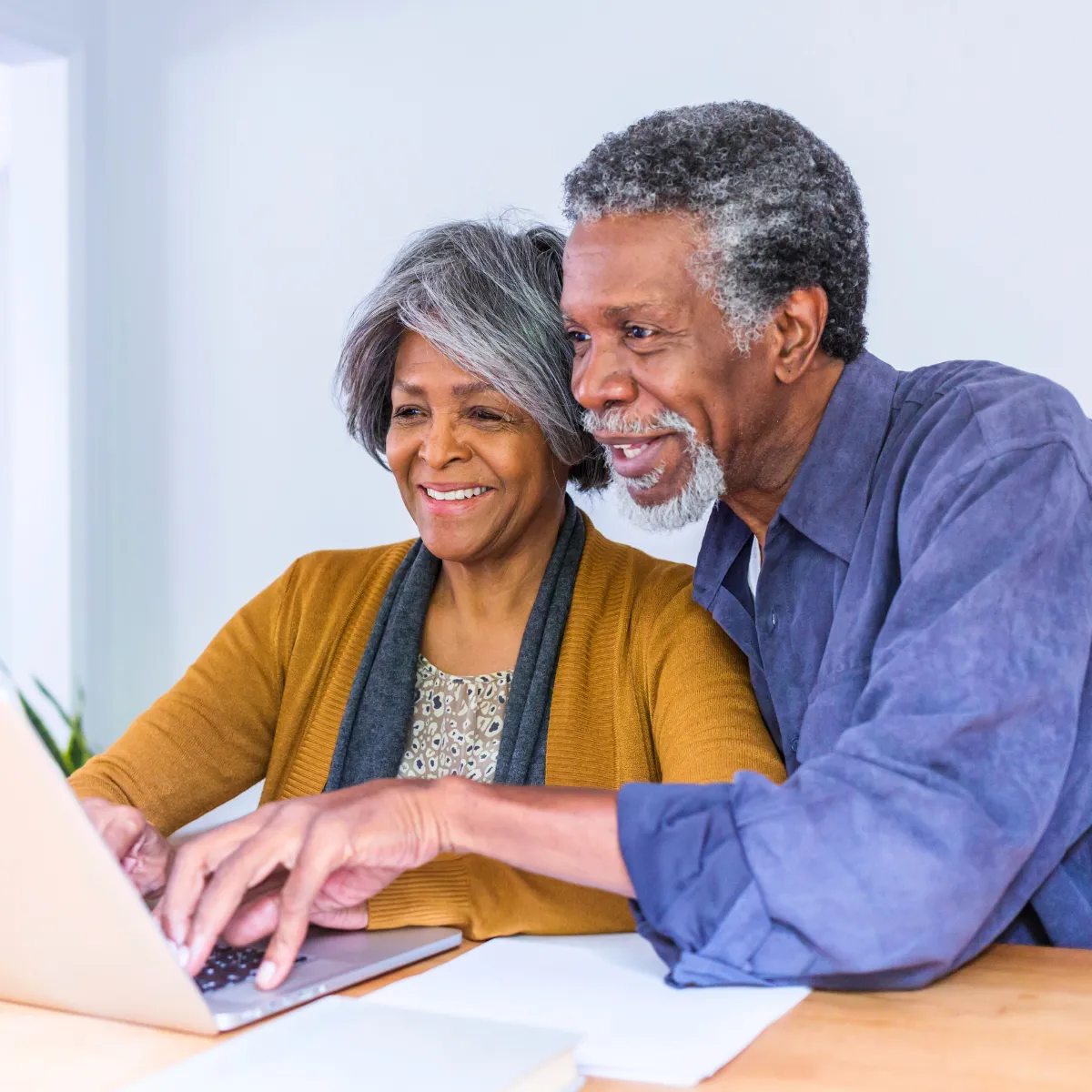 Man and woman working together on computer