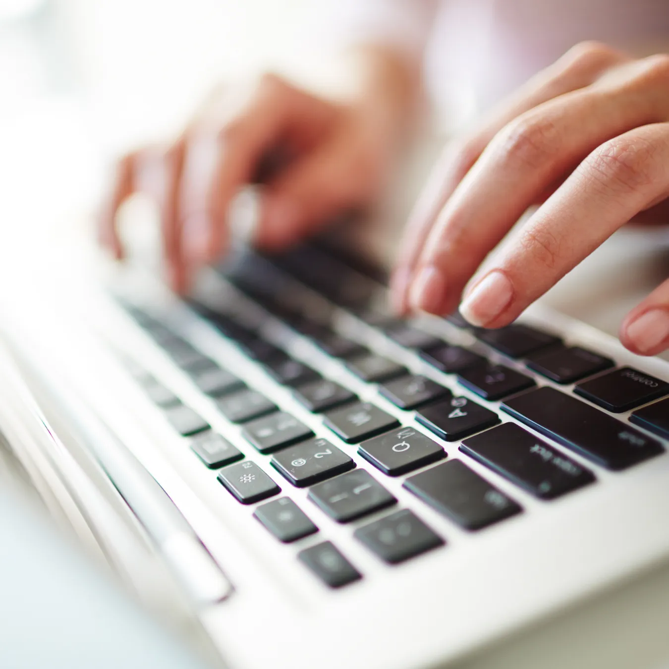 Close up of fingers on a keyboard